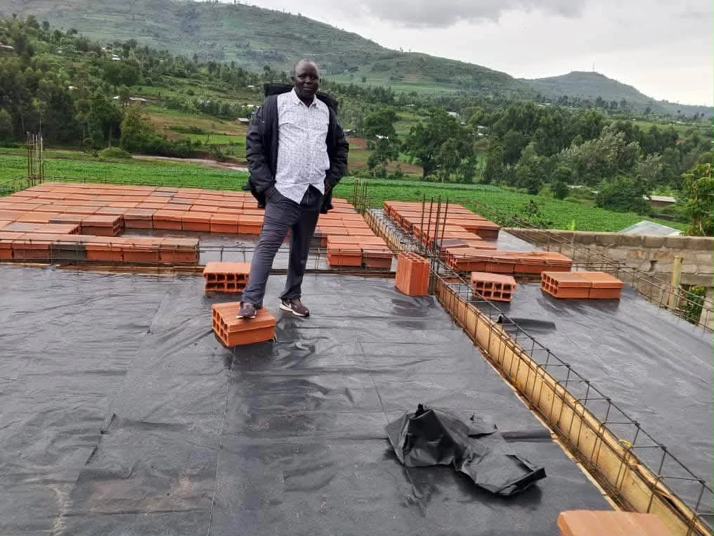 Construction work overlooking the green hills of the Bukwo area